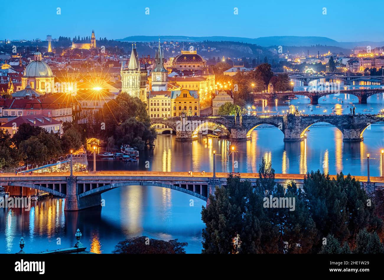 Prague city, Czech Republic, view of the bridges over Vltava river and the Old Town in blue evening light Stock Photo