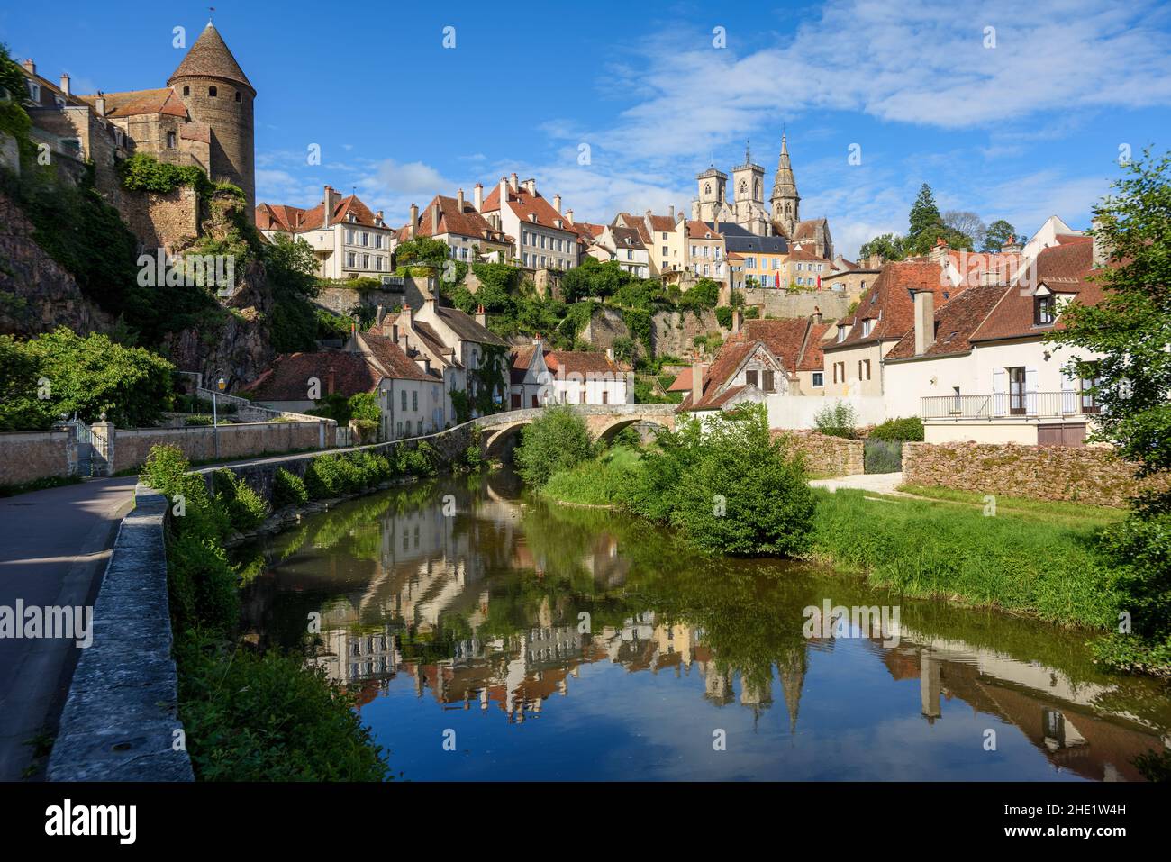 Historical Old town of medieval city of Semur en Auxois reflecting in Armancon river, Cote d'Or, Burgundy, France Stock Photo