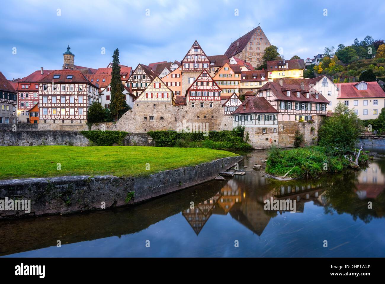 Gothic half-timbered houses reflecting in blue river in the Schwabisch Hall city Old town, Germany Stock Photo