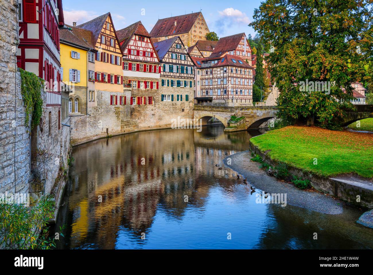 Gothic half-timbered houses reflecting in river in the Schwabisch Hall city Old town, Germany Stock Photo