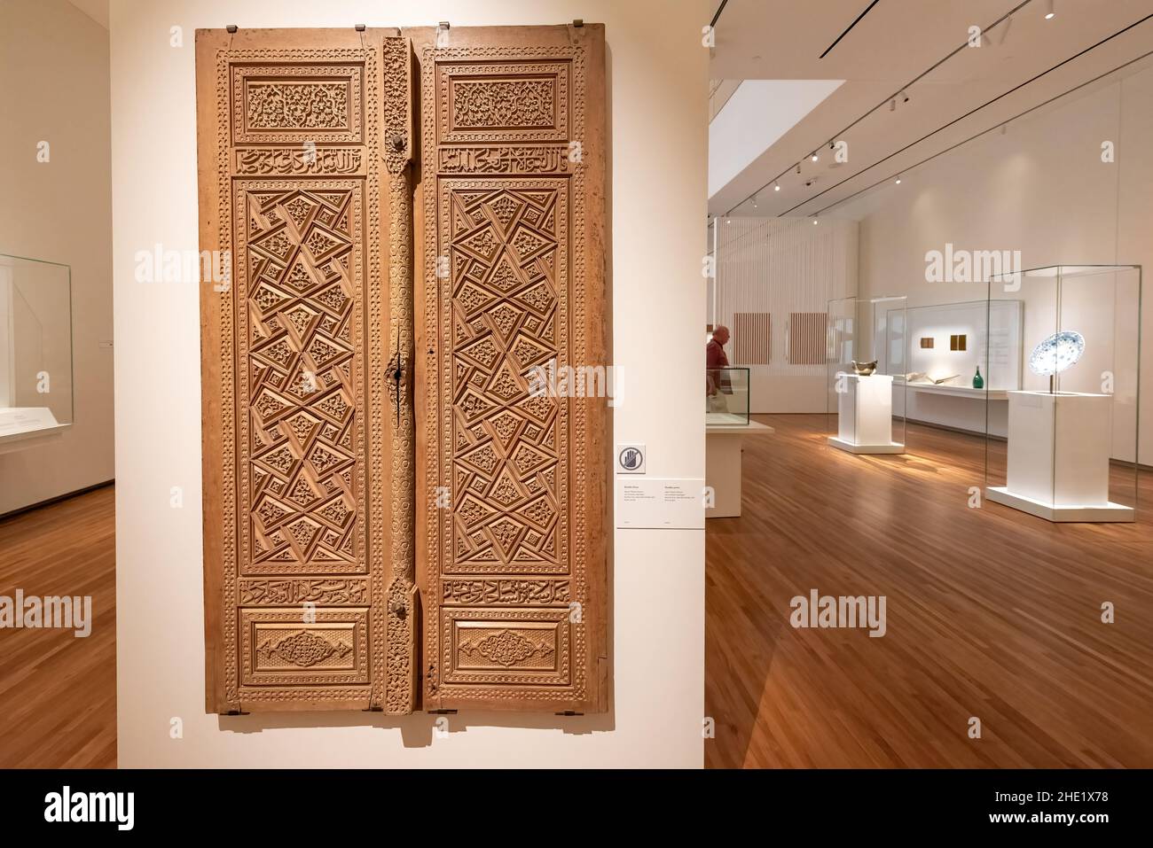 Intricately carved and panelled wooden door with geometric motifs. The Aga Khan Museum is a museum of Islamic art, Iranian art and Muslim culture.Jan. Stock Photo