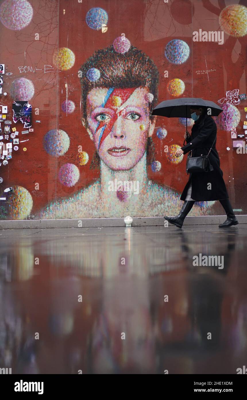 A candle tribute is placed at the David Bowie mural in Brixton, south ...