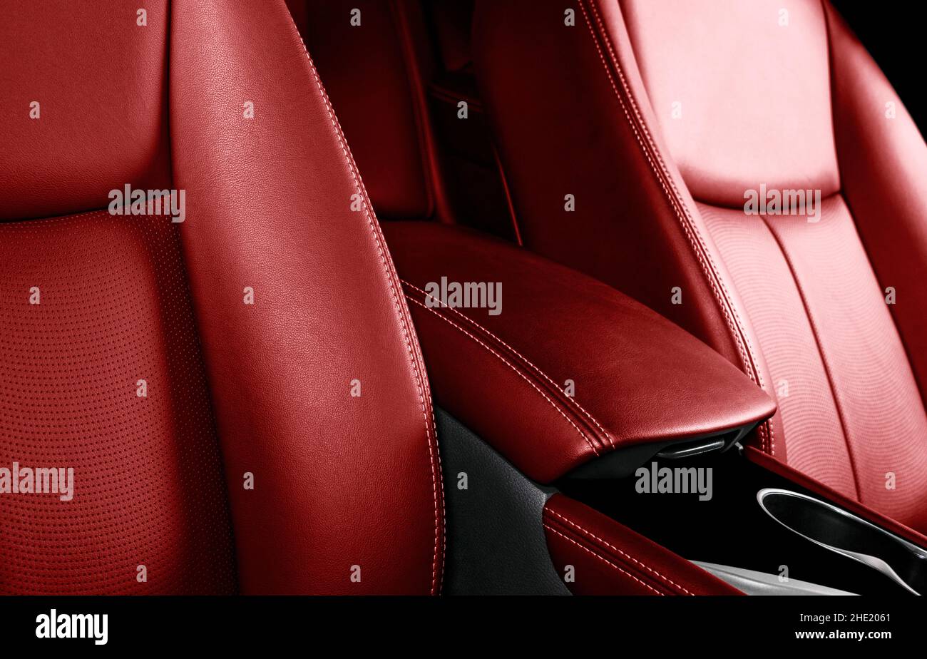 Luxury car red leather interior. Part of leather car seat details with