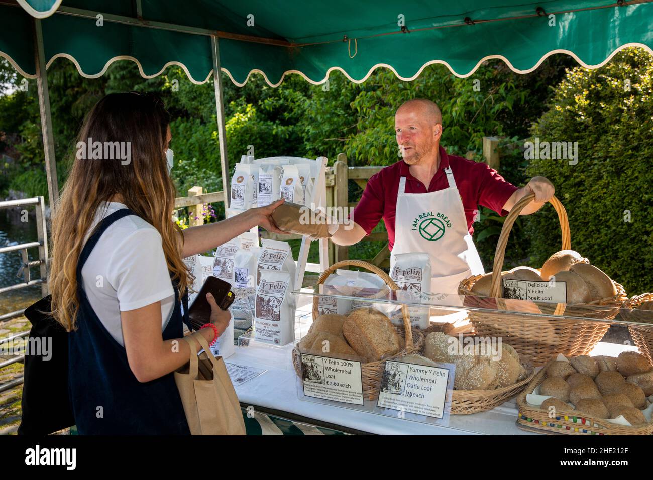 UK, Wales, Pembrokeshire, Saint Dogmaels, weekly makers’ market, Y Felin mill stall selling bread and flour Stock Photo