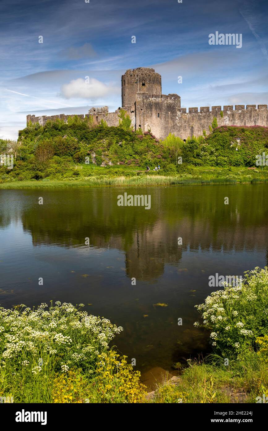 UK, Wales, Pembrokeshire, Pembroke, Castle across Mill Pond Stock Photo