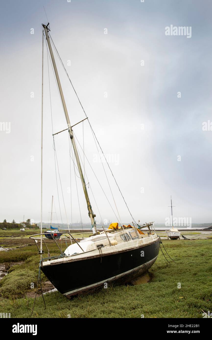 UK, Wales, Pembrokeshire, Angle, sailing boats high and dry at low tide in Angle Bay on Milford Haven Stock Photo