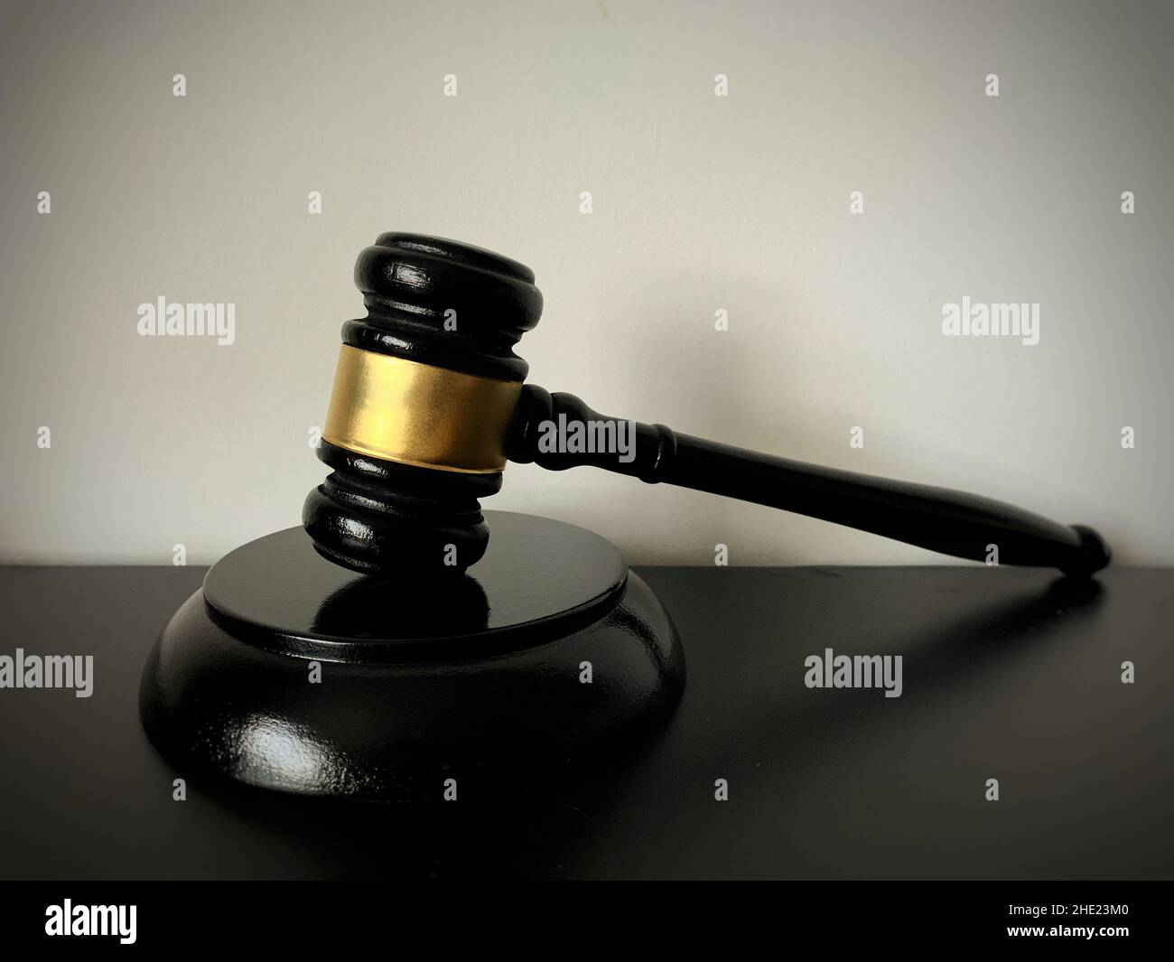 Close up of judge gavel on black table background. Law concept. Stock Photo