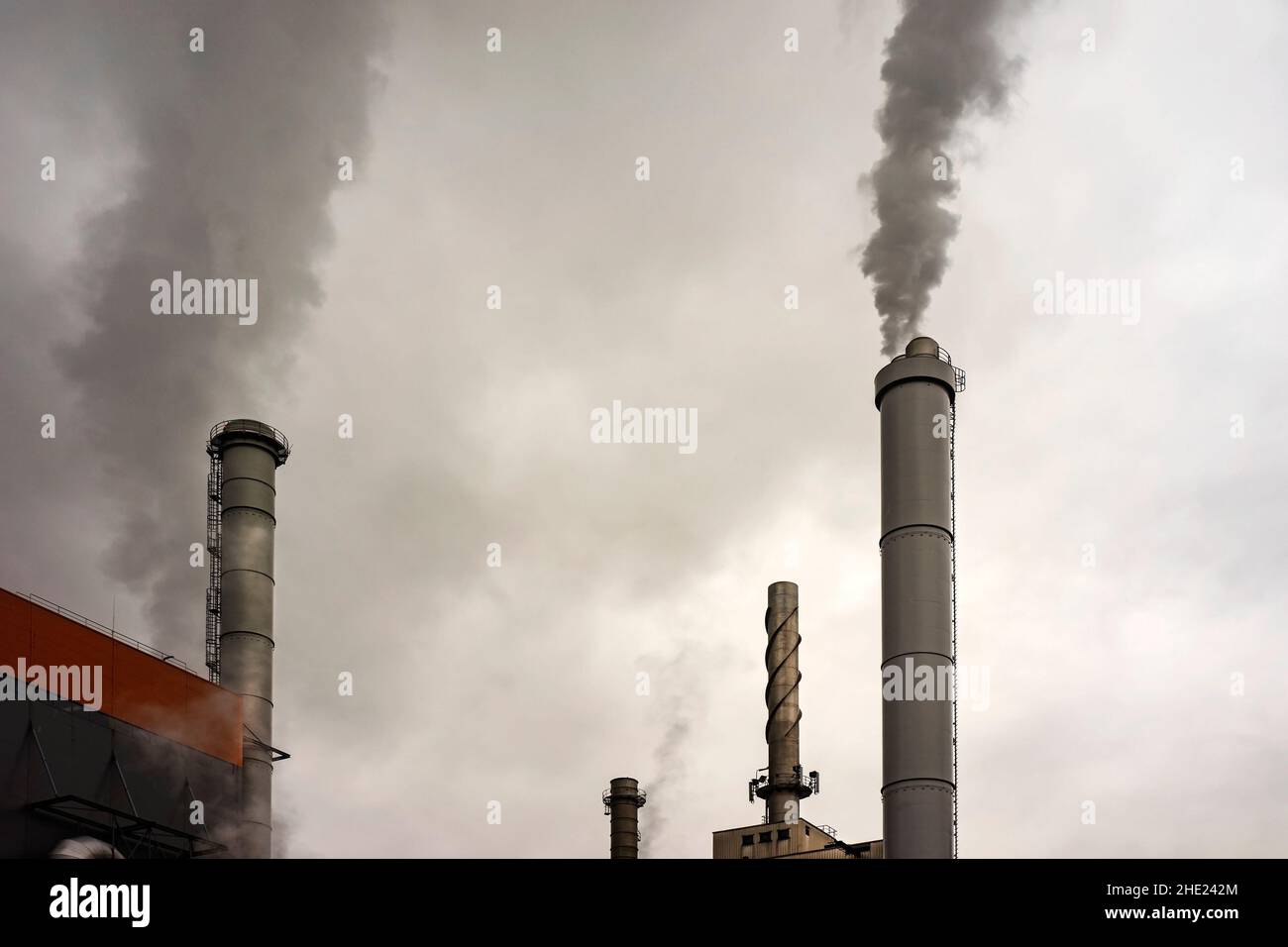 Industrial chimneys producing carbon imprint emissions Stock Photo