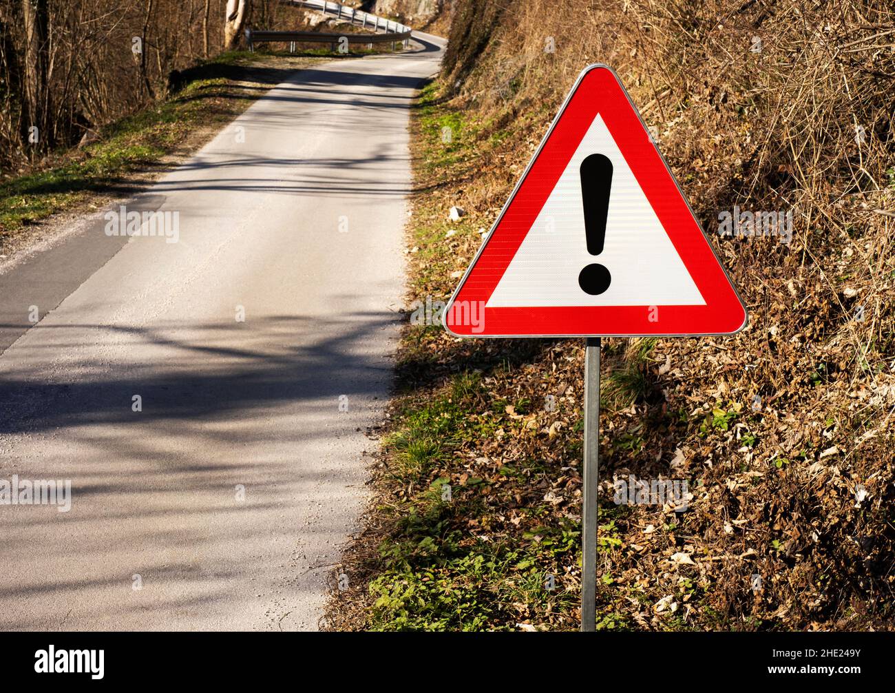 Sign for being cautious on the road up front Stock Photo