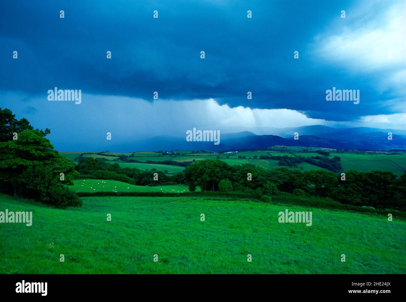 UK, Wales, Snowdonia, storm clouds over landscape, Stock Photo