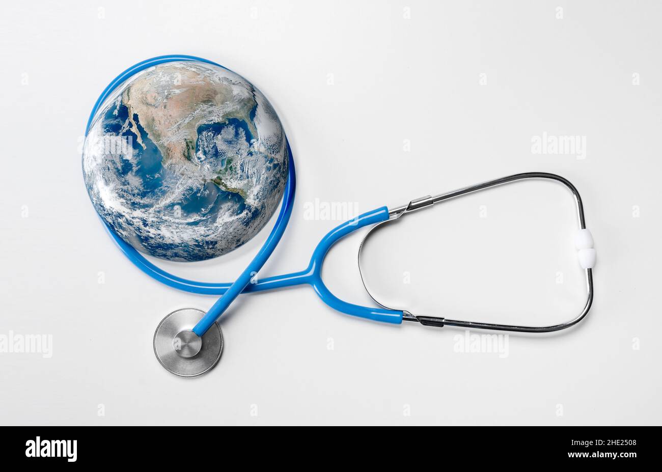Stethoscope listening planet Earth. Global Healthcare. Stethoscope wrapped around globe on white background. Global health and Green Earth day concept Stock Photo