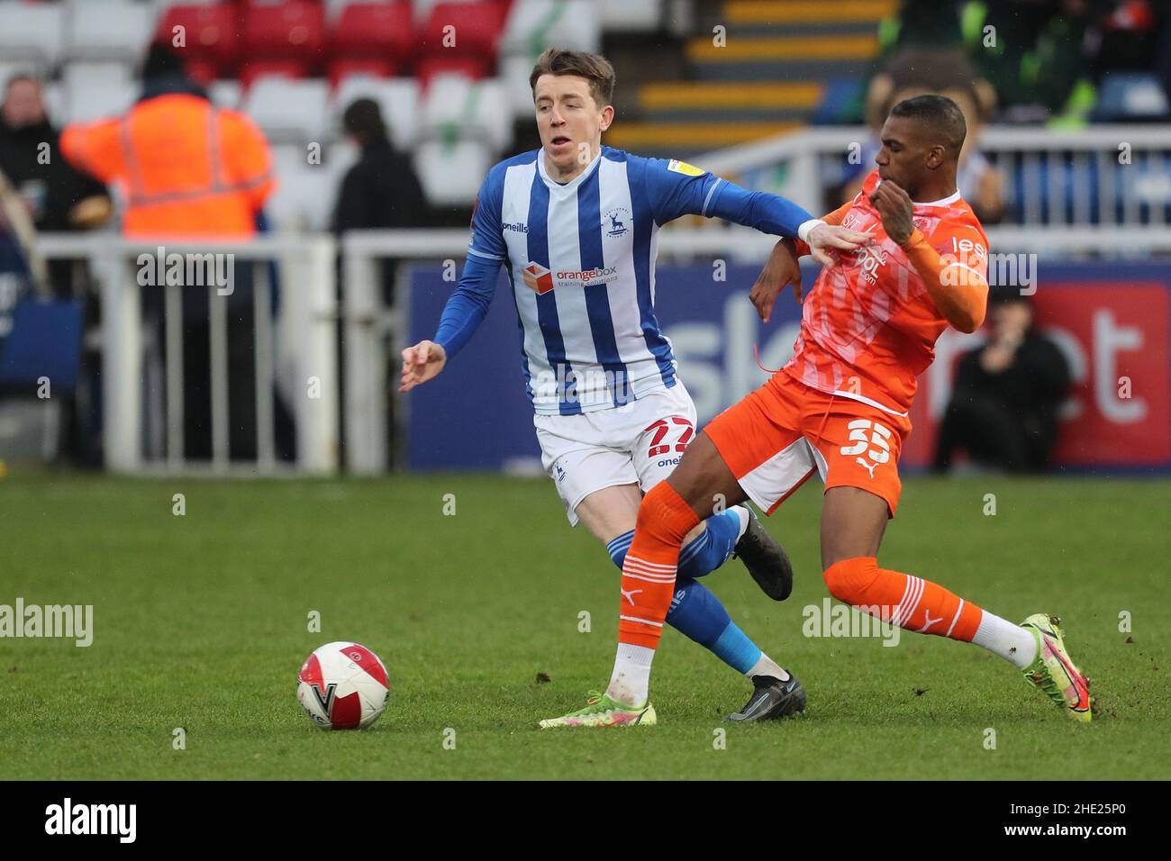 HARTLEPOOL, UK. JAN 8TH Tom Crawford of Hartlepool United is fouled by Blackpool's Dujon Sterling during the FA Cup match between Hartlepool United and Blackpool at Victoria Park, Hartlepool on Saturday 8th January 2022. (Credit: Mark Fletcher | MI News) Credit: MI News & Sport /Alamy Live News Stock Photo