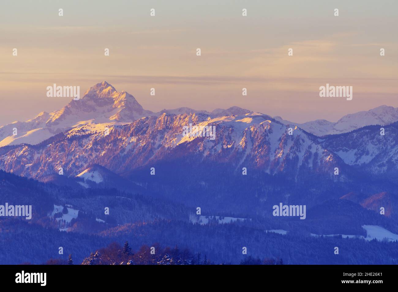Magical view of Triglav, the highest peak in Julian Alps at sunset in winter. Winter landscape. Travel, tourism, environment and serenity concepts Stock Photo