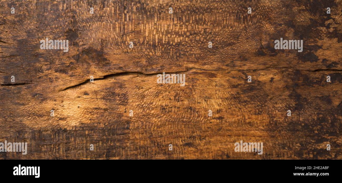 weathered wooden table top surface, brown color photography backdrop, empty full frame background, taken from above, top down view Stock Photo
