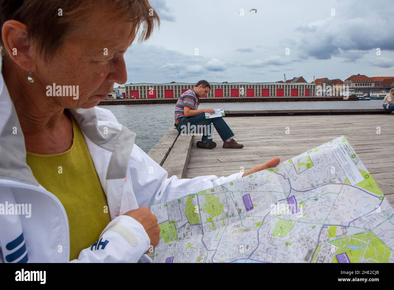 Tourist reads the map of Copenhagen. Stock Photo