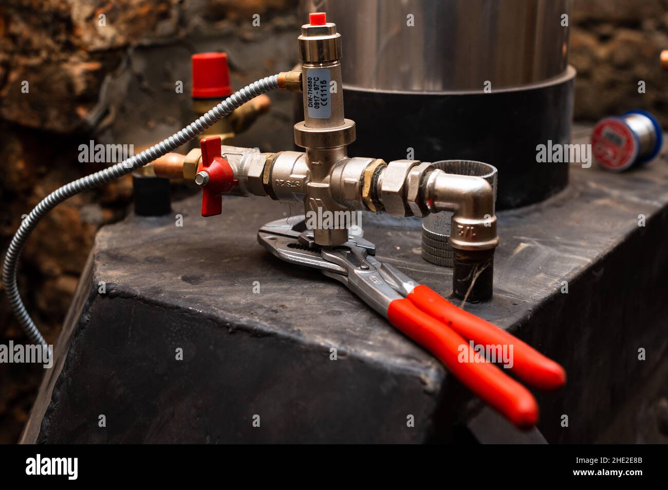 Installation of copper pipes for water supply to the fireplace Stock