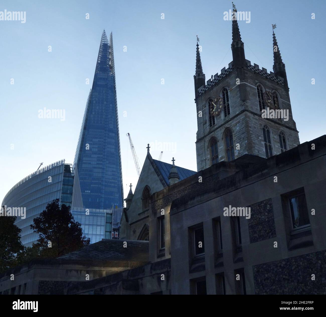 The old and the new. The Shard with Southwark Cathedral in the foreground. Stock Photo