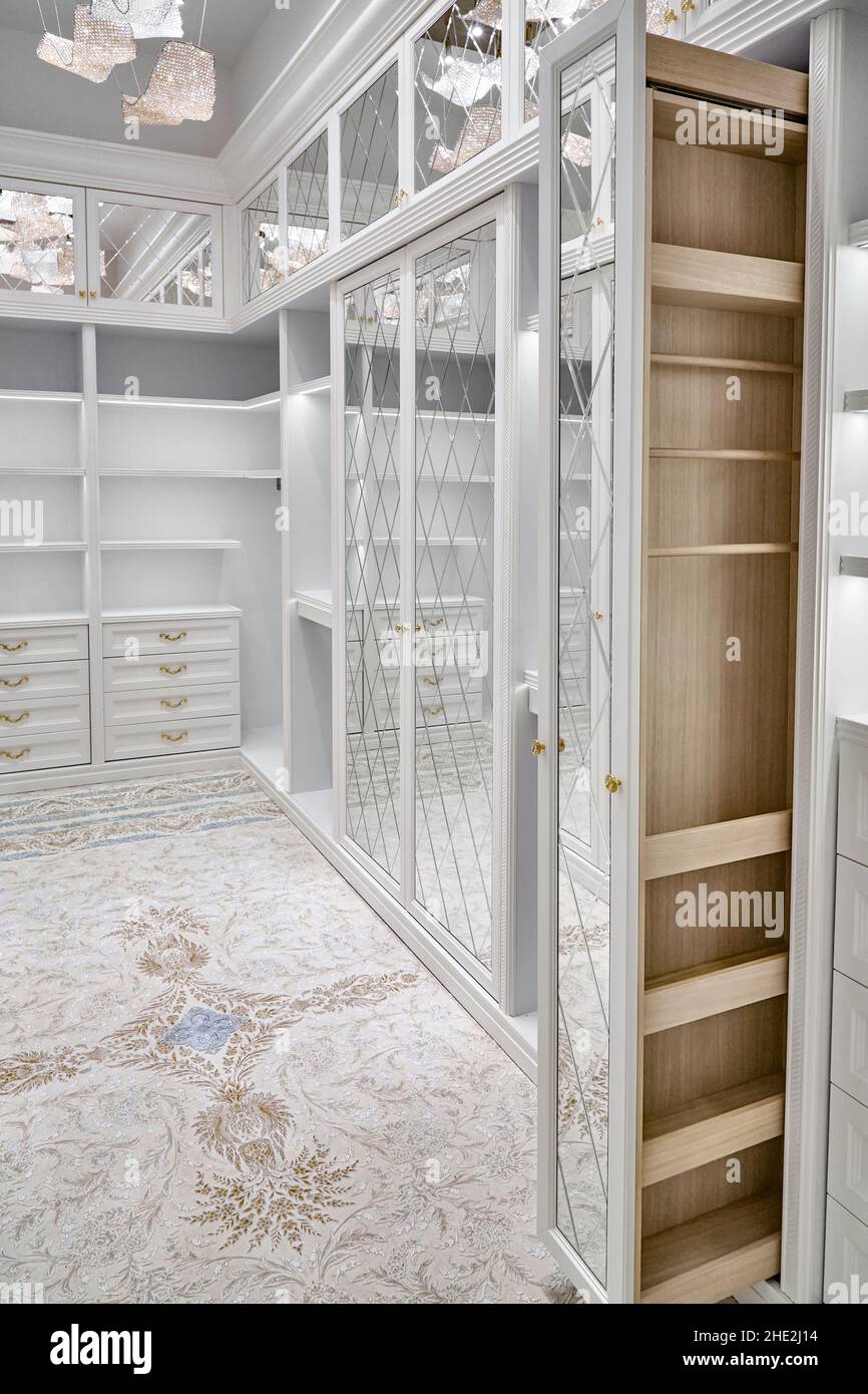 Modern luxury walk in closet interior, white - Stock
