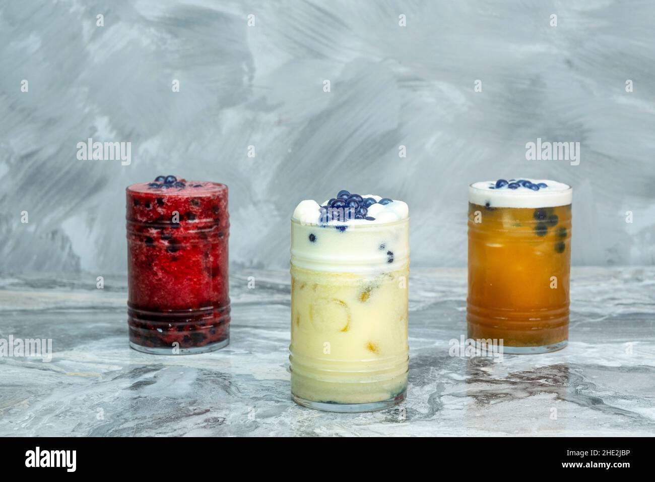 Cold drink in various flavors on a marble floor Stock Photo Alamy