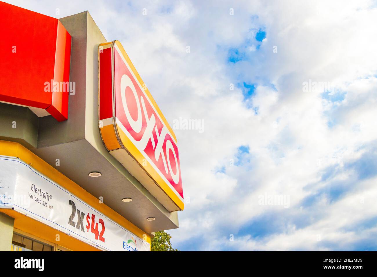 Playa del Carmen Mexico 21. December 2021 Oxxo supermarket and logo with blue cloudy sky in Playa del Carmen Mexico. Stock Photo