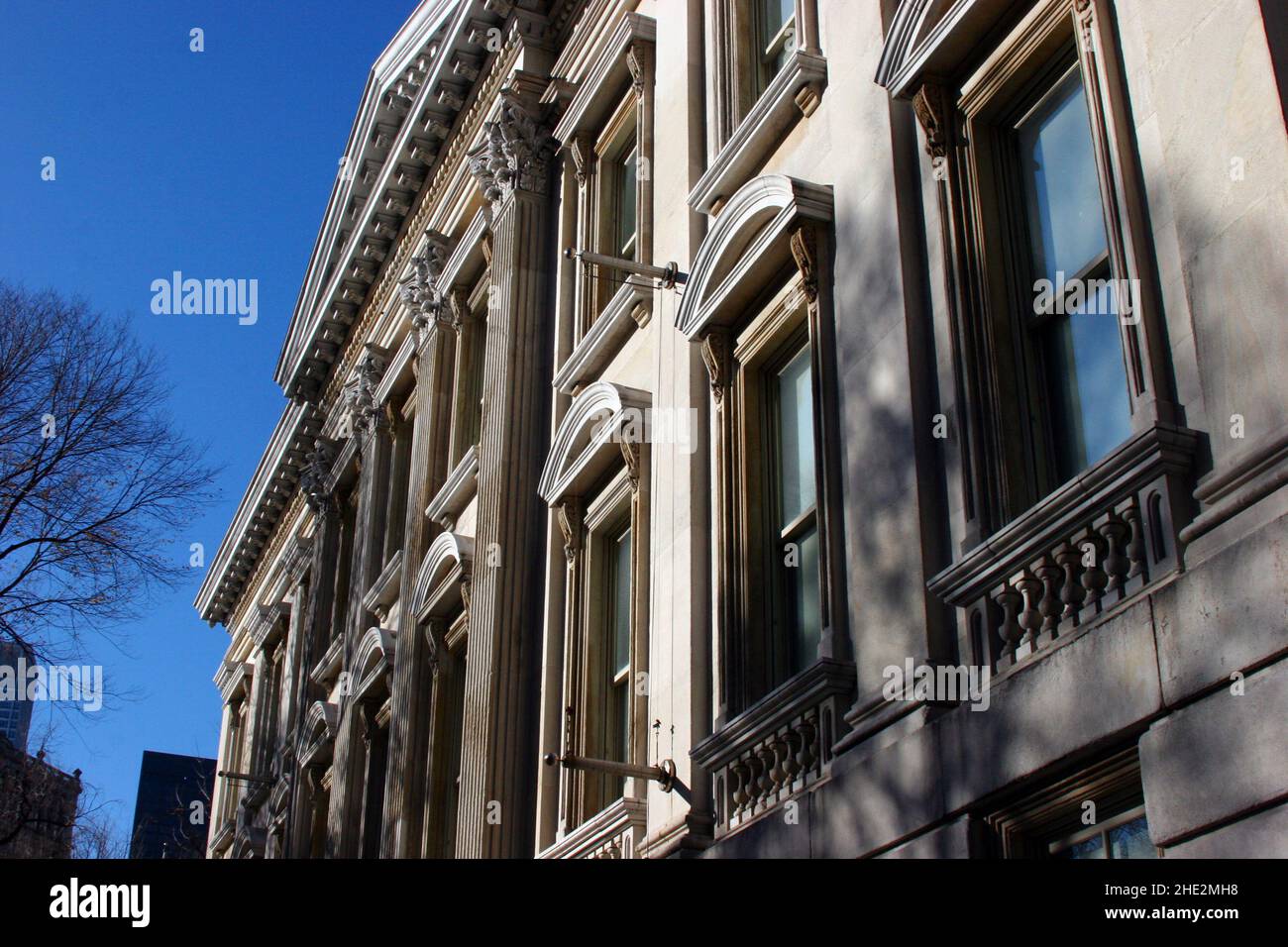 Aged building facade with windows Stock