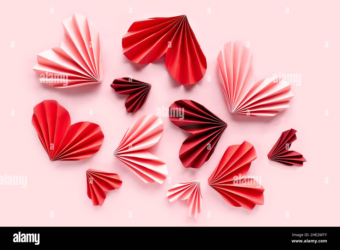 Paper hearts on pink background. Symbol of love for valentines day ...