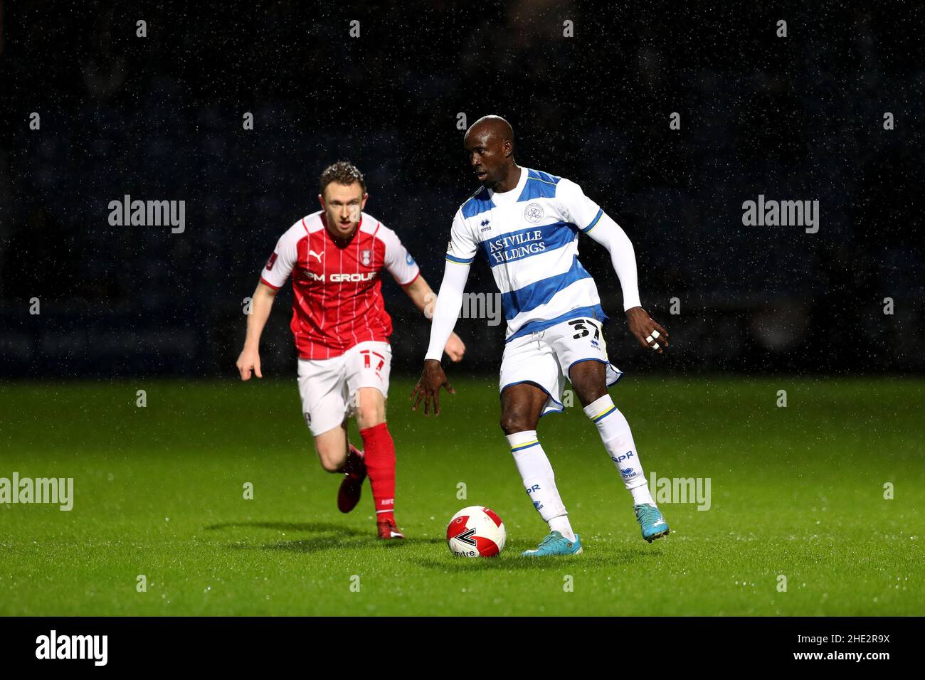 Queens Park Rangers' Albert Adomah (right) and Rotherham's Shane Ferguson battle for the ball during the Emirates FA Cup third round match at the Kiyan Prince Foundation Stadium, London. Picture date: Saturday January 8, 2022. Stock Photo