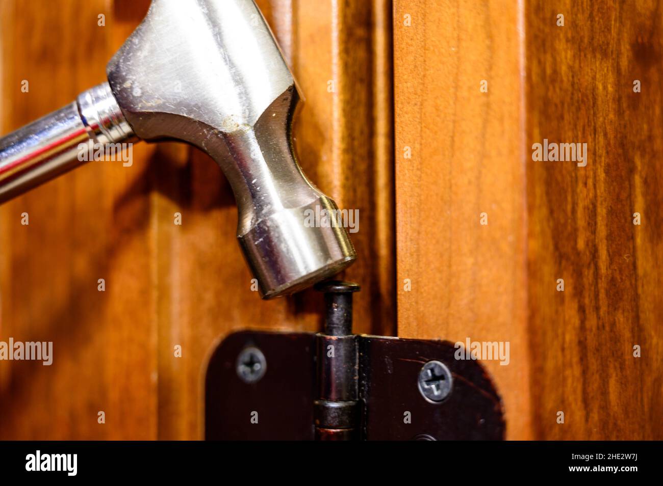 Oiled bronze door hinge with pin being removed Stock Photo Alamy