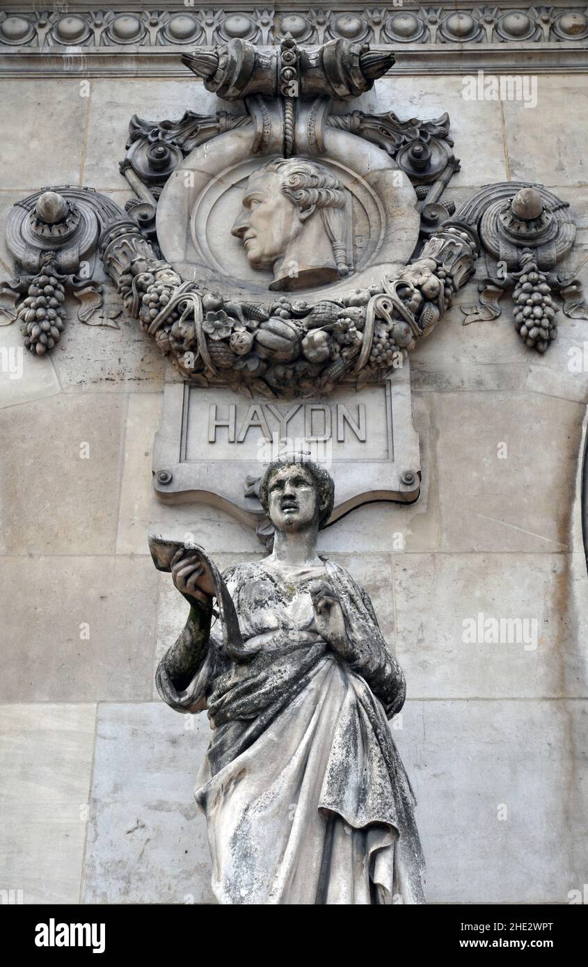 A medallion of composer Franz Joseph Haydn is pictured above the sculpture The Song at Paris' Palais Garnier opera house. Stock Photo