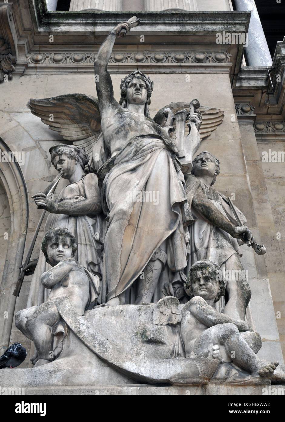Jean-Baptiste Claude Eugène Guillaume's sculpture La musique instrumentale stands outside the landmark Palais Garnier opera house in Paris. Stock Photo