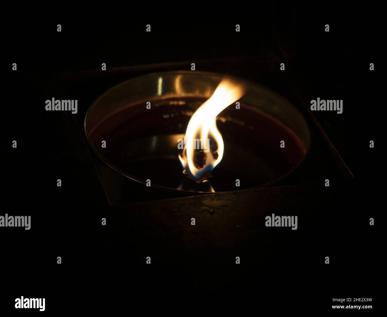 wax candle flame light on black background Stock Photo - Alamy