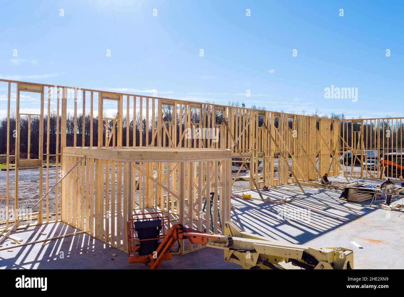 Timber frame house stick built home under construction new build with wooden truss, beam framework Stock Photo