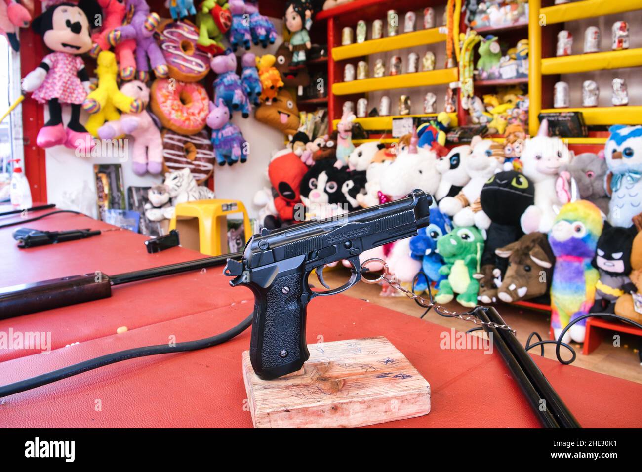Close up of a gun in a shooting gallery Stock Photo
