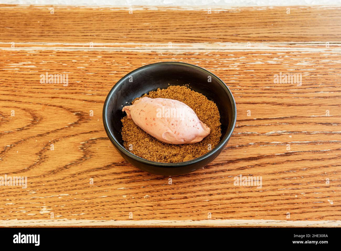 Strawberry Ice Cream Quenelle with Cookie Sand Stock Photo Alamy