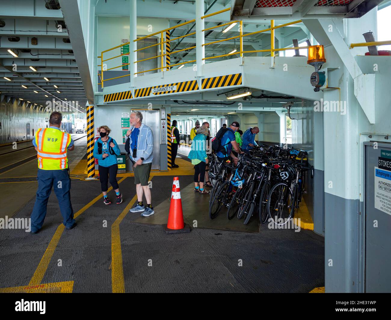 WA21013-00...WASHINGTON - Cyclists arranging their bicycles  as they bord a Washington State ferry at Anacortes on their way to Orcas Island, part of Stock Photo