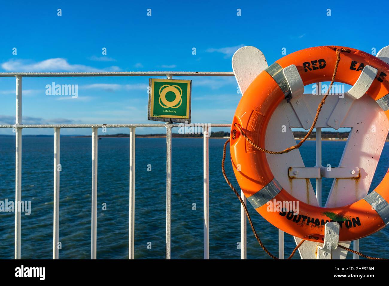 Orange lifebuoy with sign next to it onboard of the Red Eagle (Red funnel) ferry in Southampton, England, UK Stock Photo