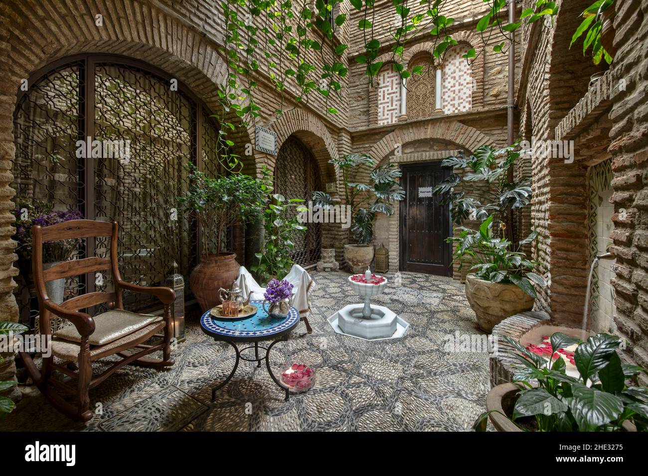 Inner courtyard of an Arabstyle house with fountains, tea service and