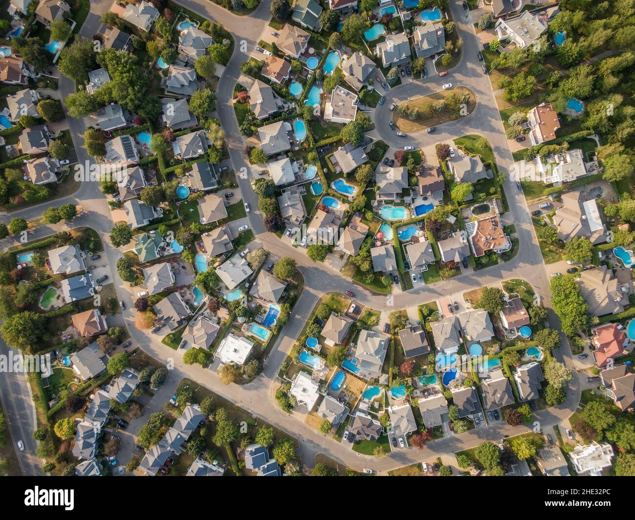 Top down aerial view of houses and streets in residential neighbourhood in Montreal, Quebec, Canada. Property, homes and real estate concept. Stock Photo