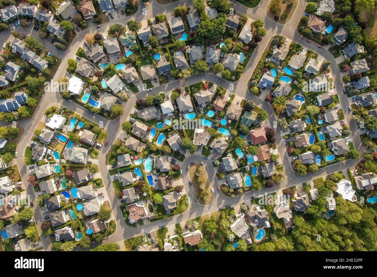 Top down aerial view of houses and streets in residential neighbourhood in Montreal, Quebec, Canada. Property, homes and real estate concept. Stock Photo