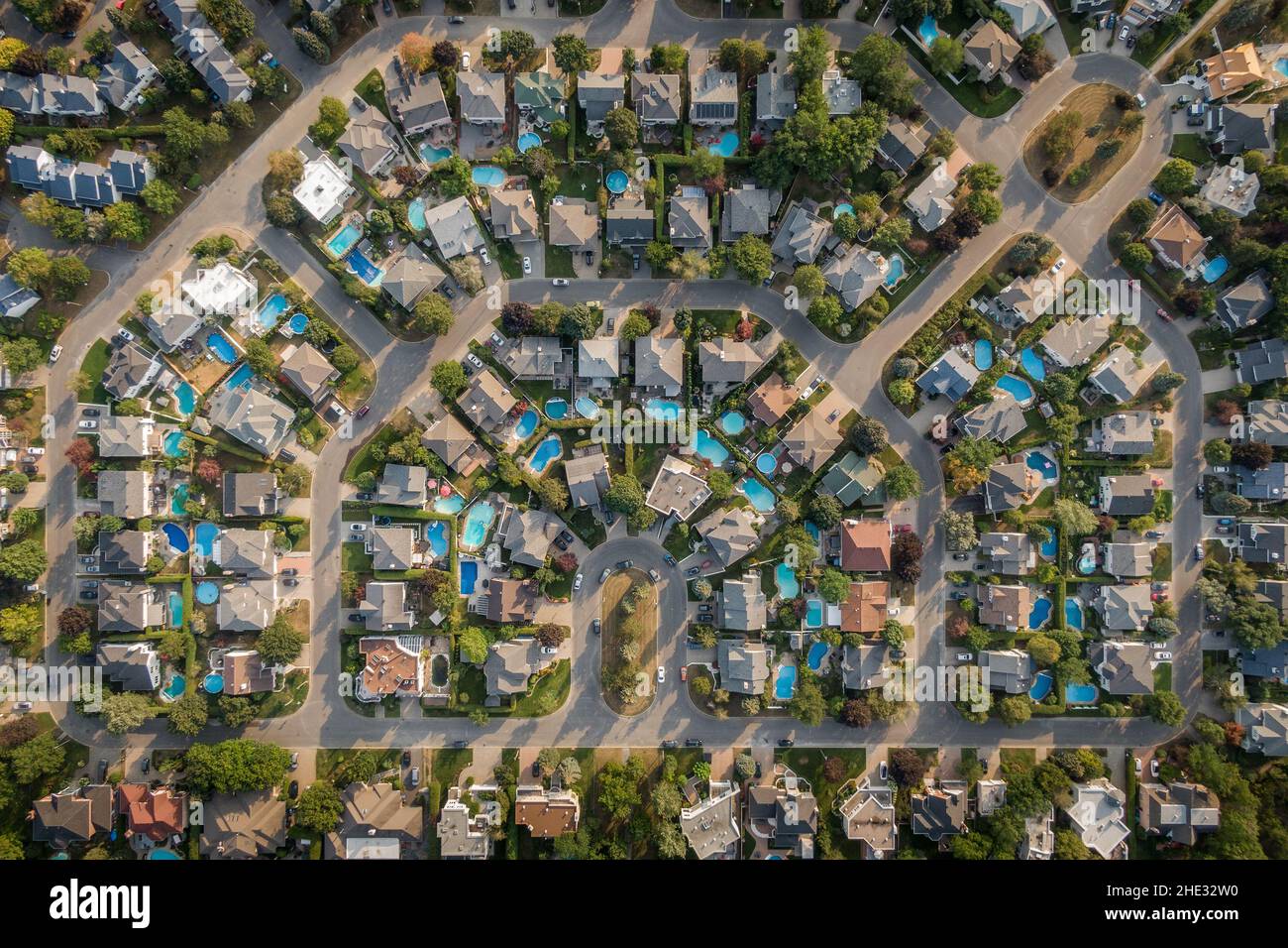 Top down aerial view of houses and streets in residential neighbourhood