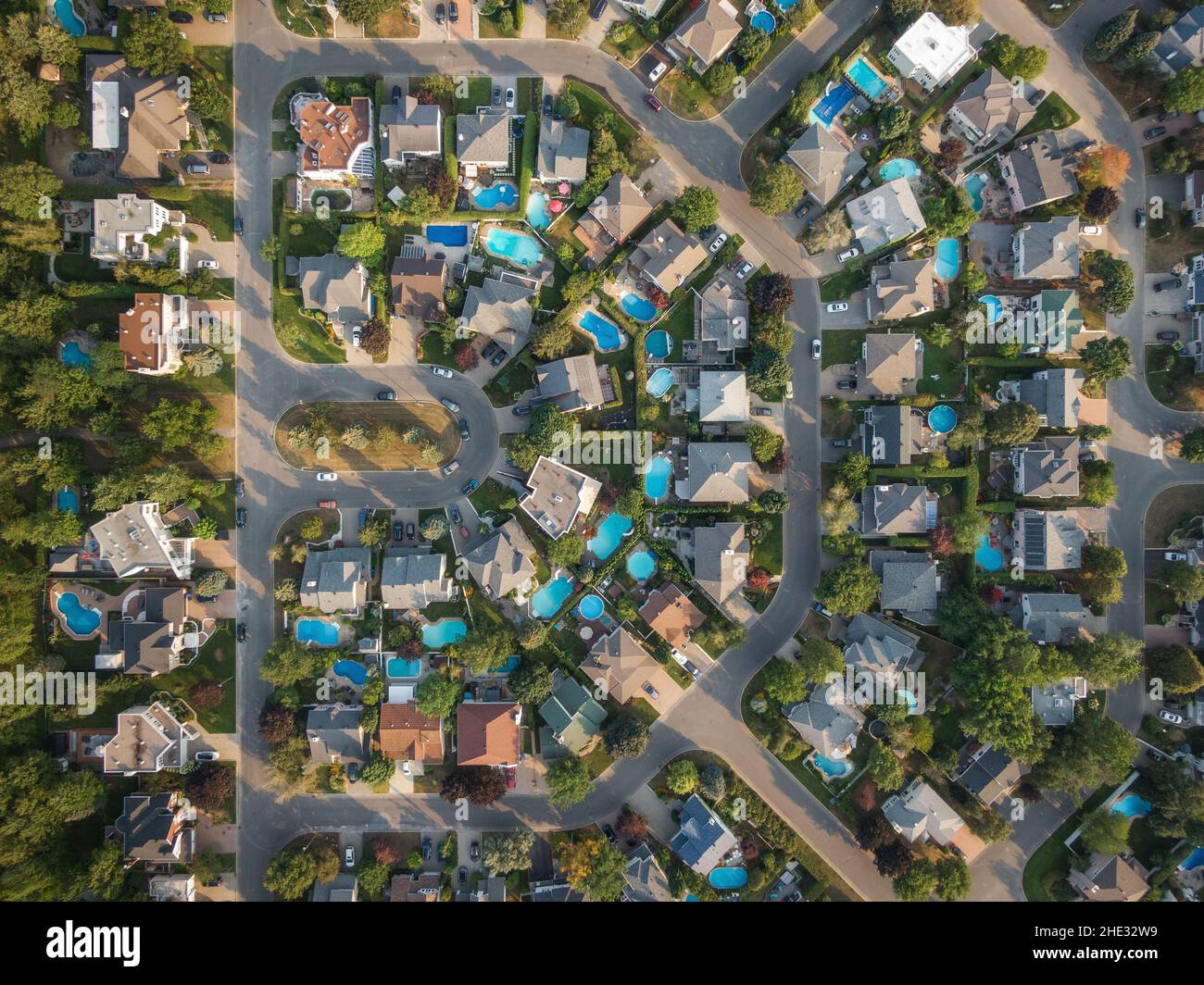 Top down aerial view of houses and streets in residential neighbourhood in Montreal, Quebec, Canada. Property, homes and real estate concept. Stock Photo