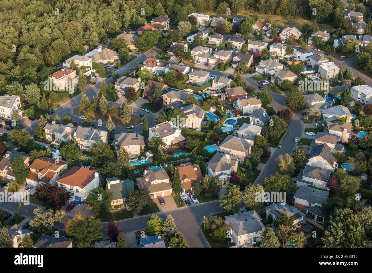 Aerial view of houses and streets in beautiful residential neighbourhood in Montreal, Quebec, Canada. Property, homes and real estate concept. Stock Photo