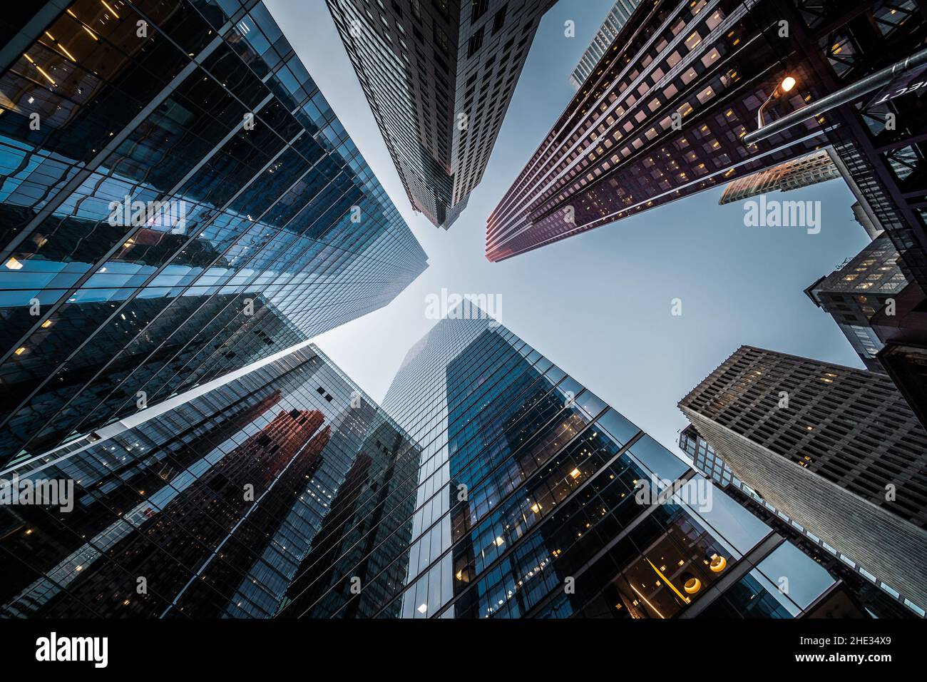 Business and finance concept, looking up at high rise office building architecture in the financial district of a modern metropolis. Stock Photo