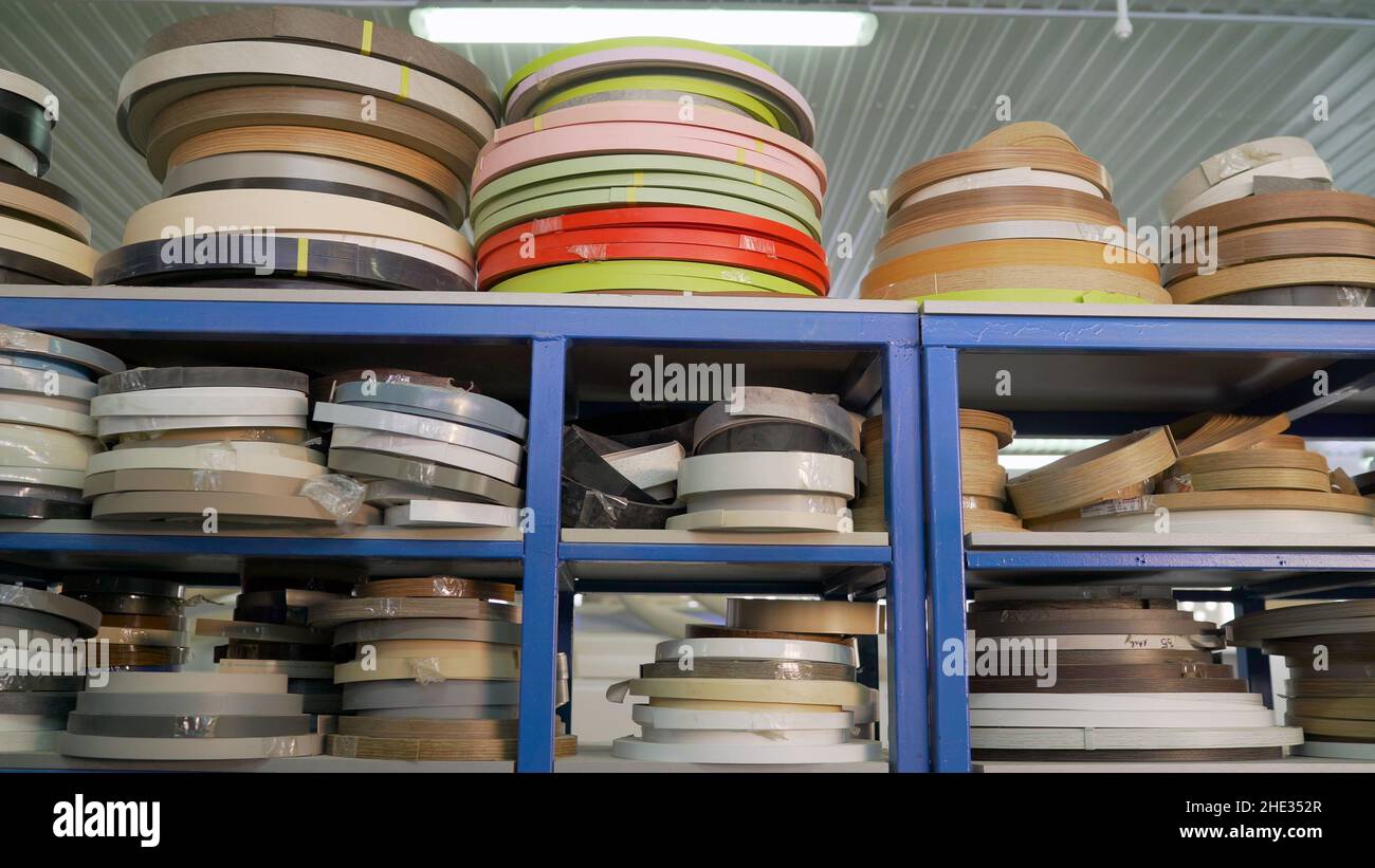 Adhesive edge for furniture on shelves. Edge Banding furniture. Furniture edges and plywood