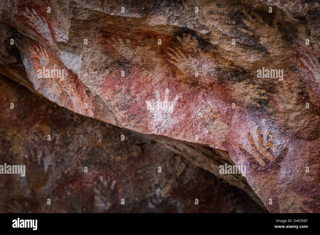 Prehistoric hand paintings at the Cave of the Hands aka Cueva de Las Manos in Santa Cruz Province, Argentine Patagonia, South America. Stock Photo