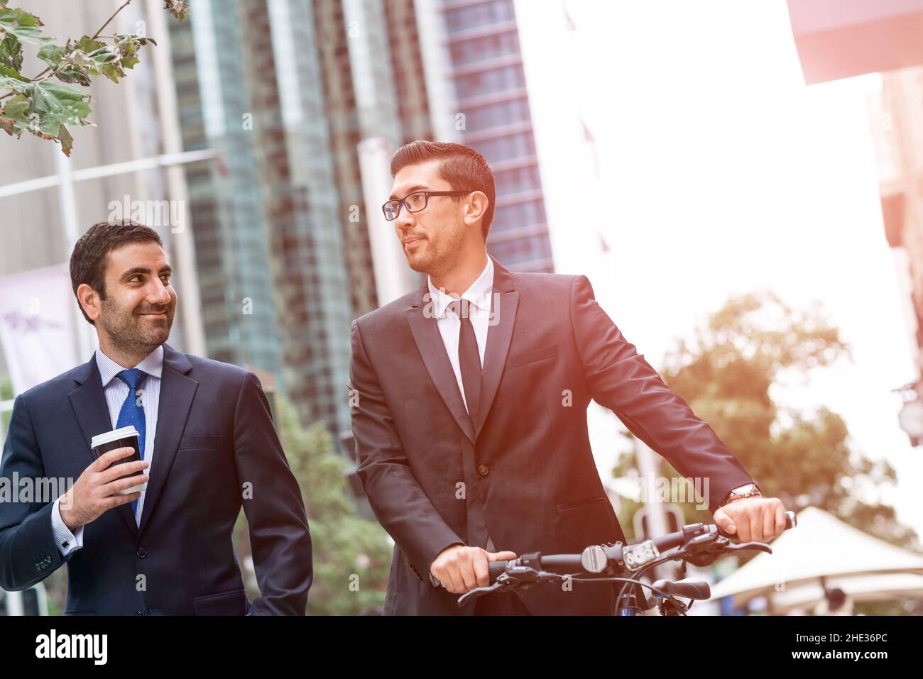 Two businessmen having walk Stock Photo - Alamy