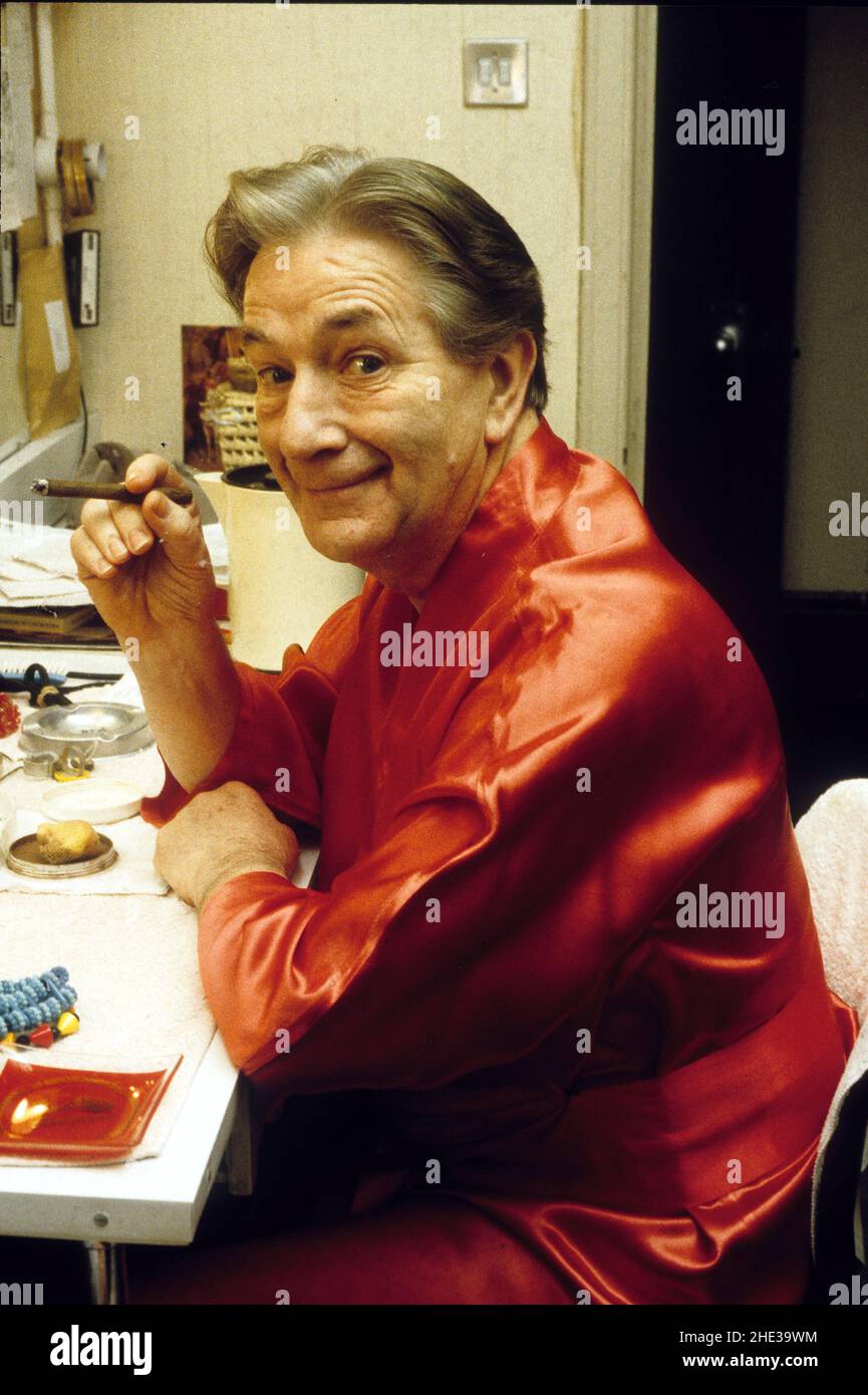 Welsh actor Wyn Calvin known affectionately as 'The Clown Prince of Wales' and 'The Welsh Prince of Laughter', smoking a cigar in his dressing room  as  pantomime dame in Jack and the Beanstalk 1988 Stock Photo
