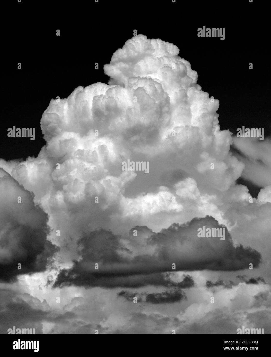 Darkening cumulus clouds form in the sky over the American Southwest. Stock Photo