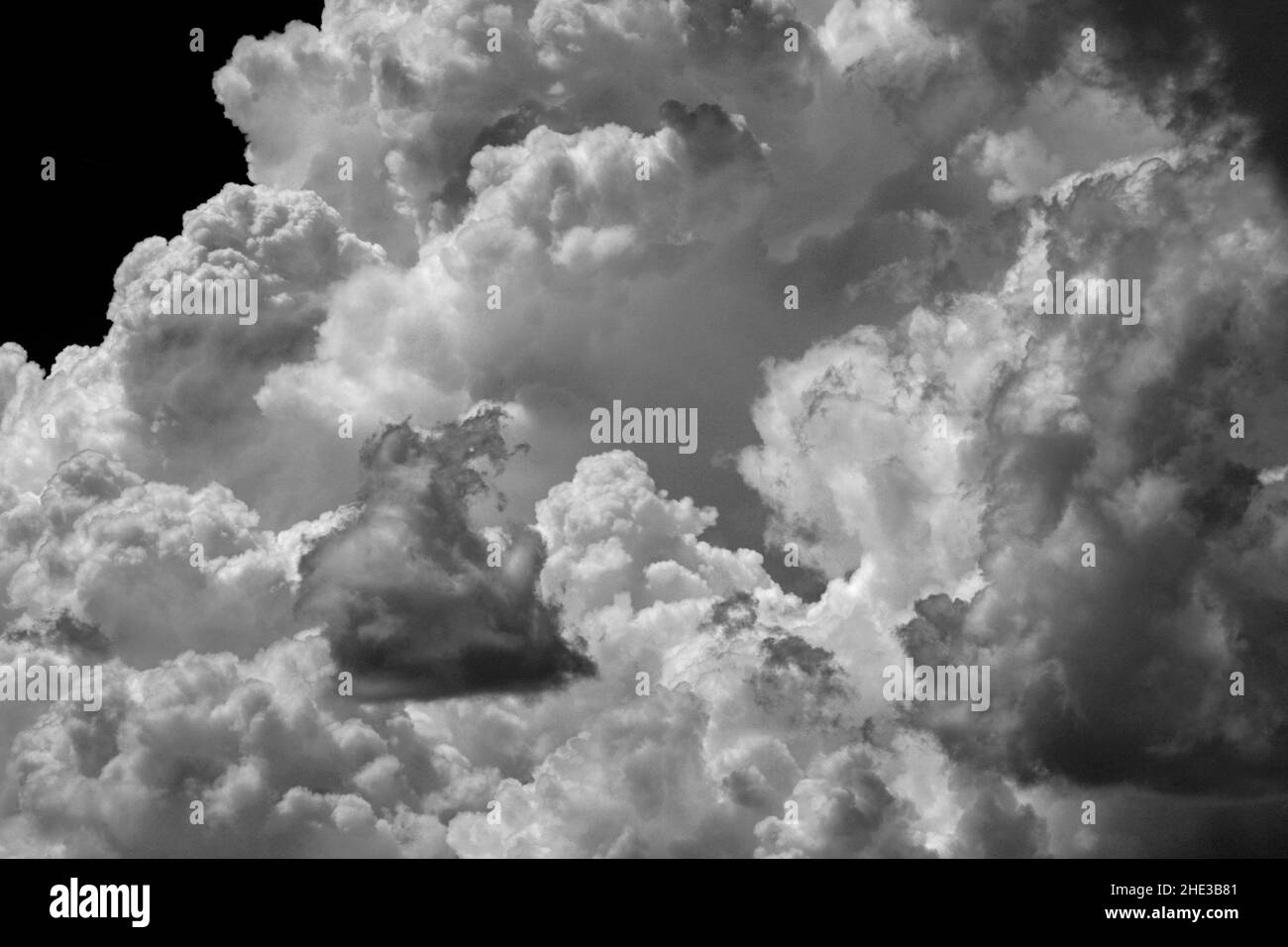 Darkening cumulus clouds form in the sky over the American Southwest. Stock Photo