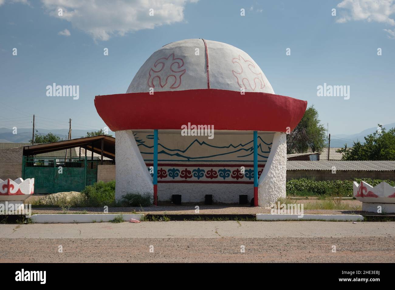 Kyrgyz bus stop in the shape of traditional central asian kalpak hat, Kyrgyzstan Stock Photo